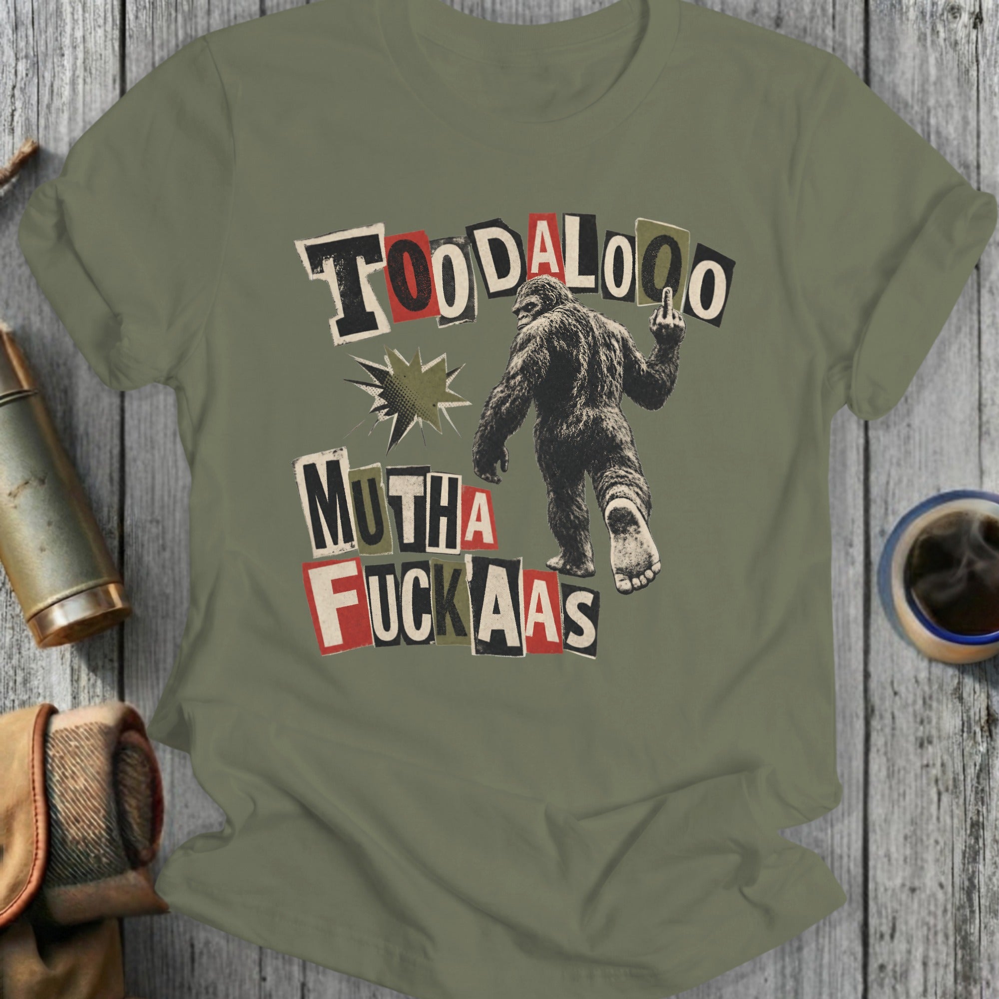 Bigfoot giving middle finger with text "TOODALOO MUTHA FUCKAS"