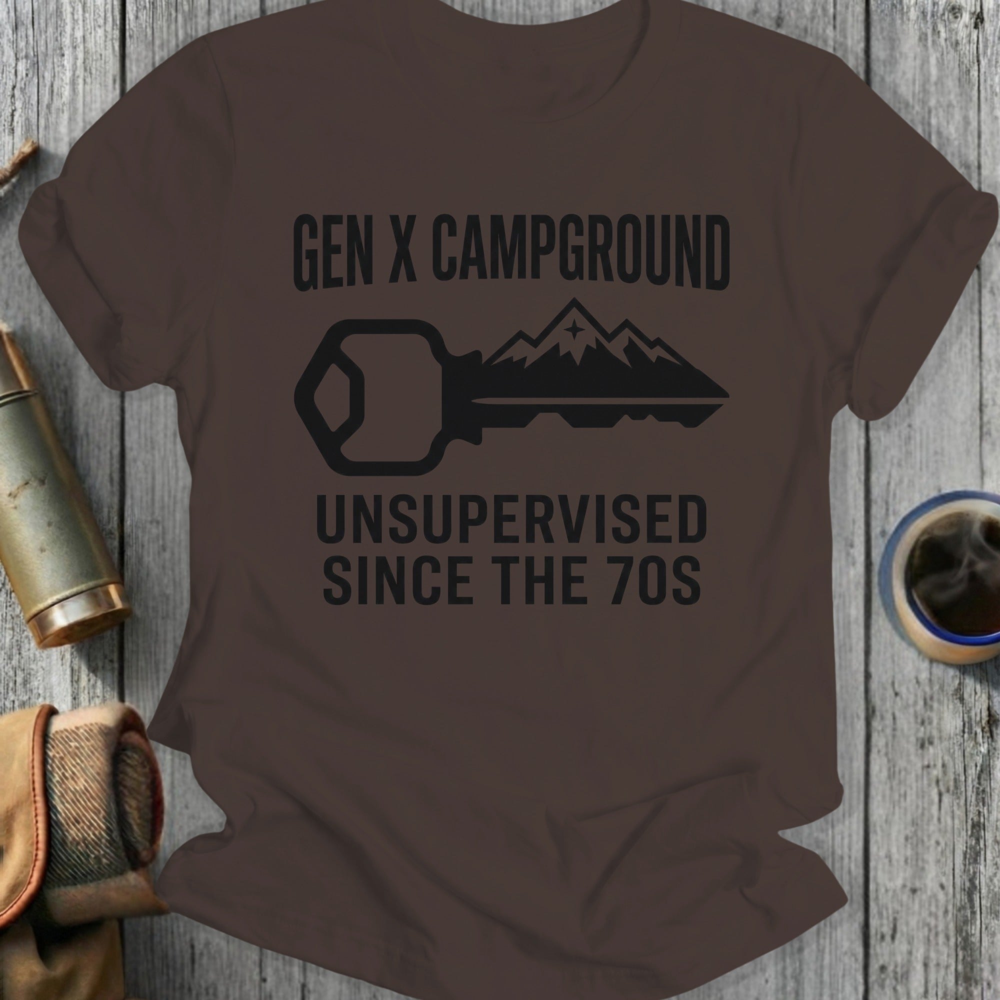 Gen X Campground Unsupervised Since the 70s graphic on a brown t-shirt.