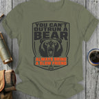 Green t-shirt with bear graphic and text "You Can't Outrun A Bear Always Bring A Slow Friend".
