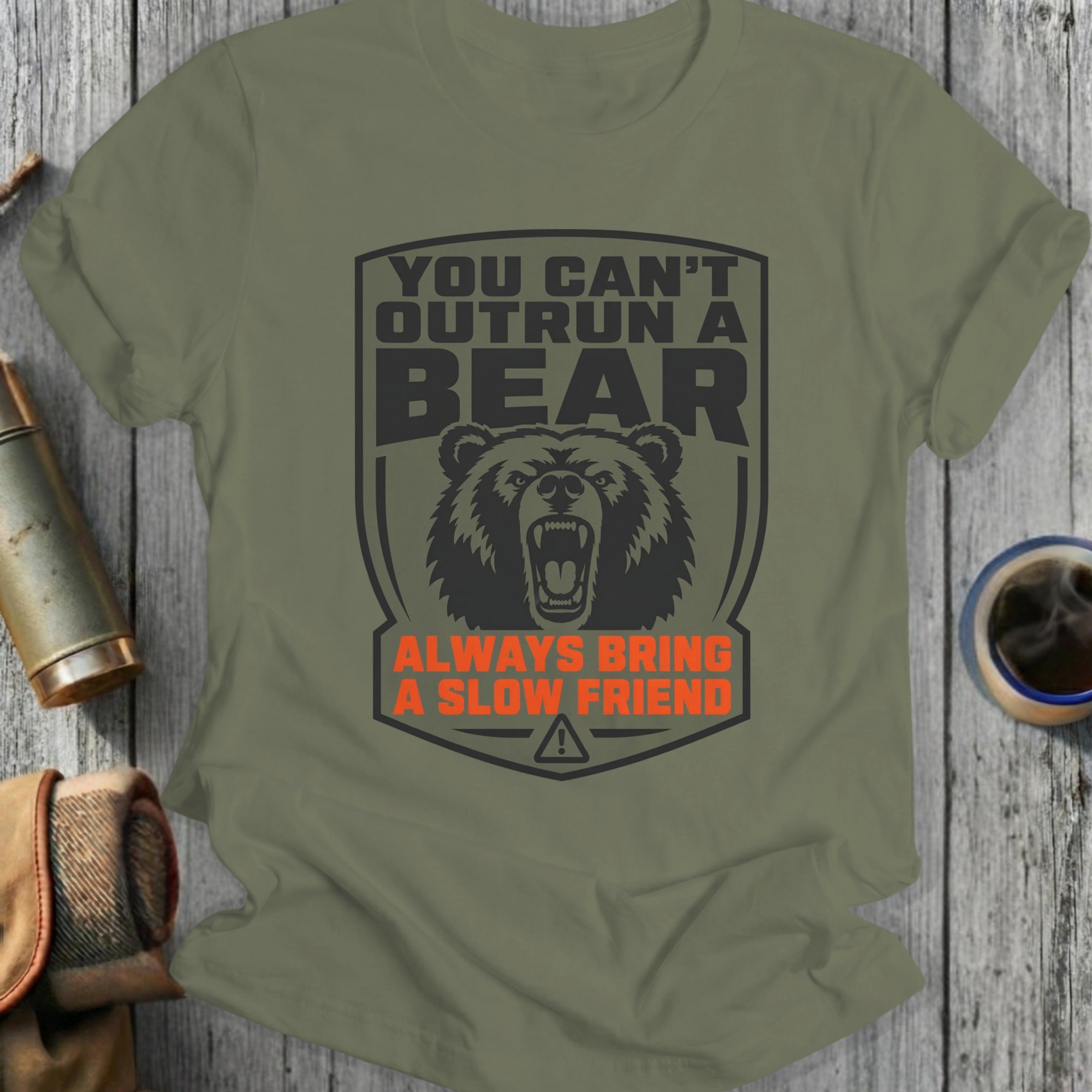 Green t-shirt with bear graphic and text "You Can't Outrun A Bear Always Bring A Slow Friend".