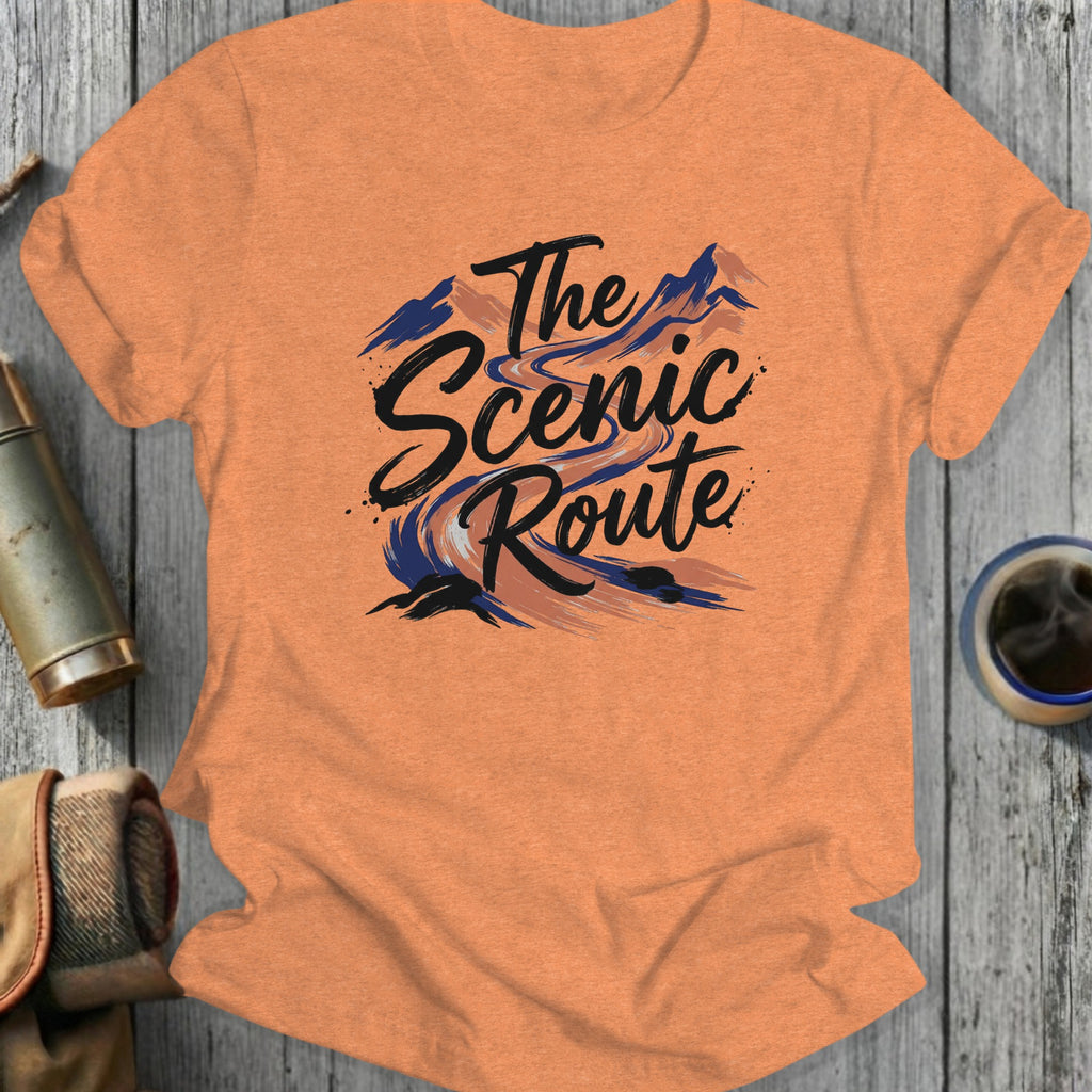 Orange t-shirt with "The Scenic Route" text and mountain landscape graphic.