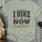 Shirt with "Apparently I Hike Now Recreational Wanderer" text and mountain graphic.