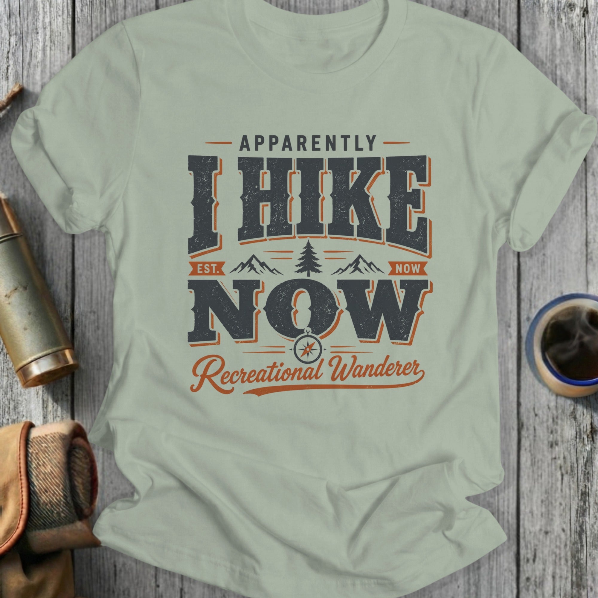Shirt with "Apparently I Hike Now Recreational Wanderer" text and mountain graphic.