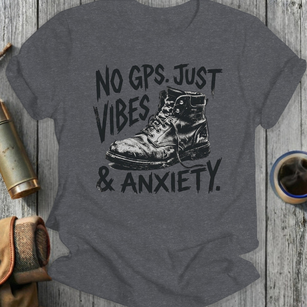 Dark grey t-shirt with distressed boot graphic and text "NO GPS. JUST VIBES & ANXIETY."