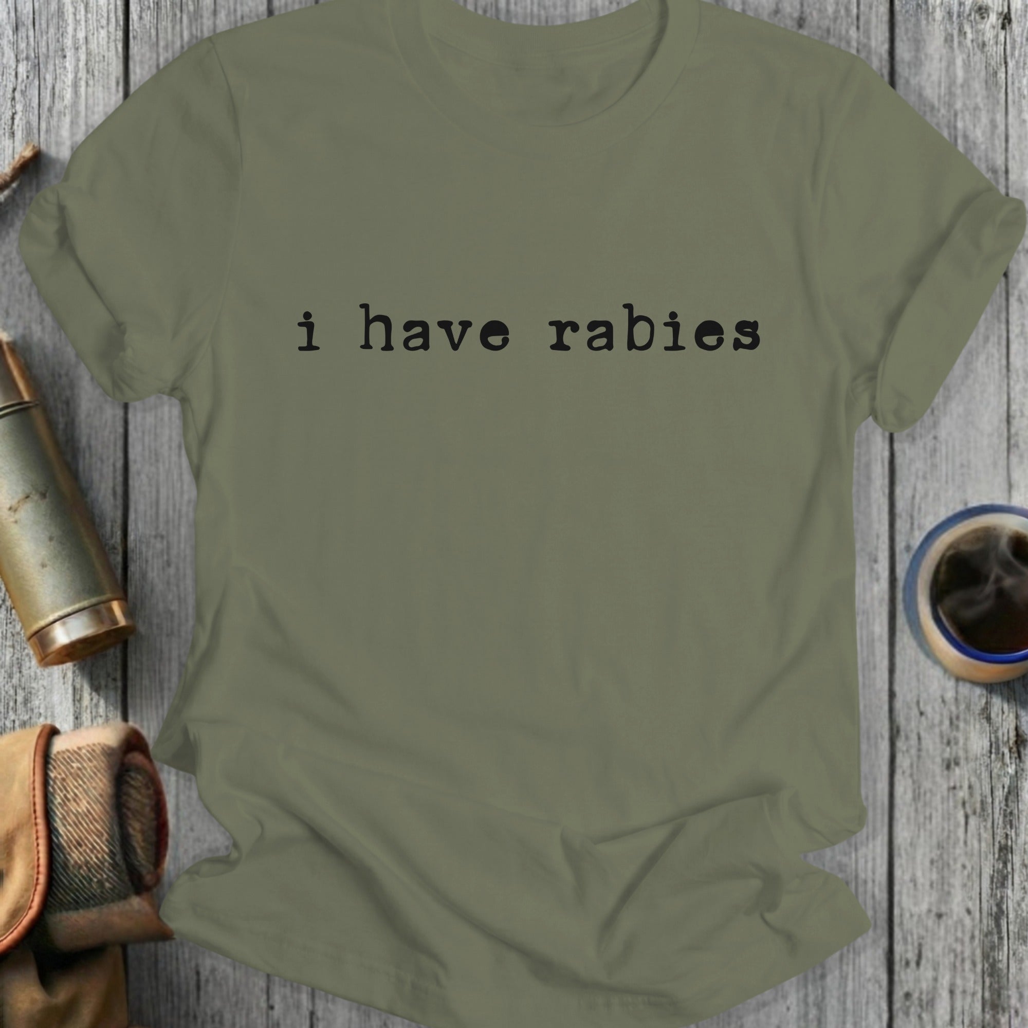 Green t-shirt with black text "i have rabies"