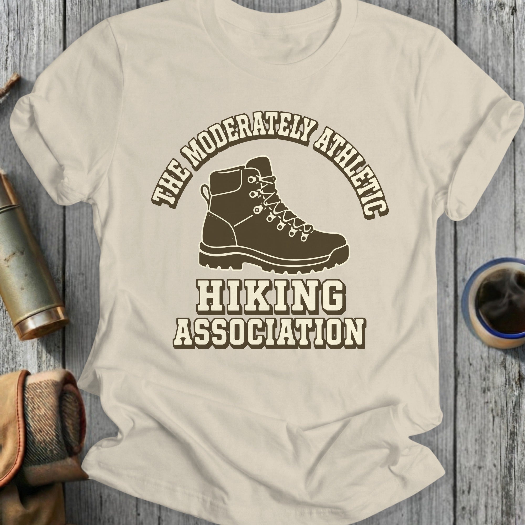 T-shirt with "The Moderately Athletic Hiking Association" text and hiking boot graphic.