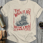 Cream t-shirt with distressed red graphic: "THE WALK IT OFF HIKING COMMITTEE"