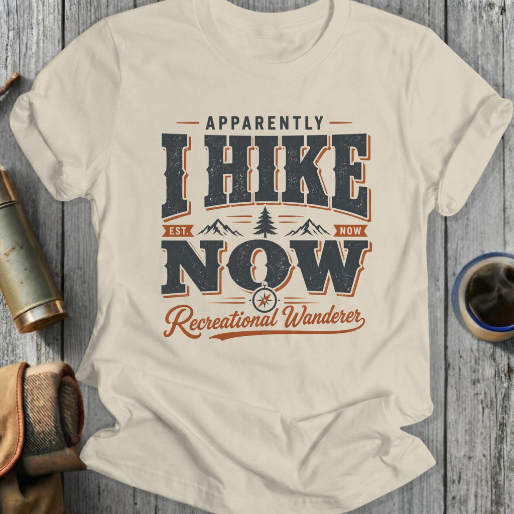 T-shirt with "Apparently I Hike Now Recreational Wanderer" text, mountains, and compass.