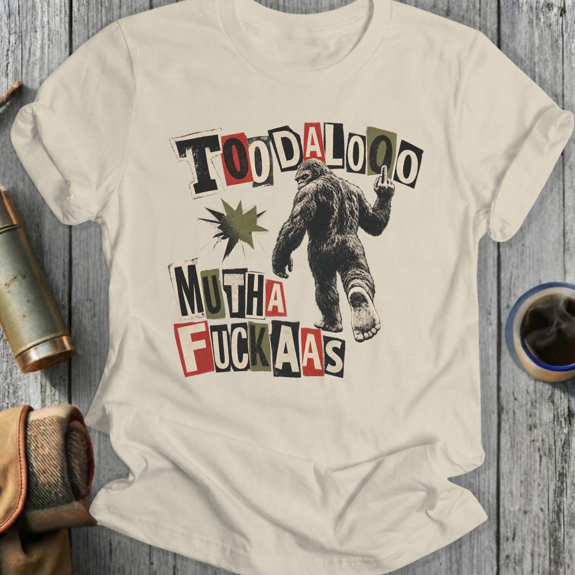 Bigfoot giving middle finger with text "TOODALOO MUTHA FUCKAAS"