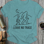 Line art of an alien and Bigfoot walking under a moon with "LEAVE NO TRACE" text.