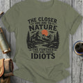 Olive green t-shirt with "The Closer You Are To Nature, The Further You Are From Idiots" text.