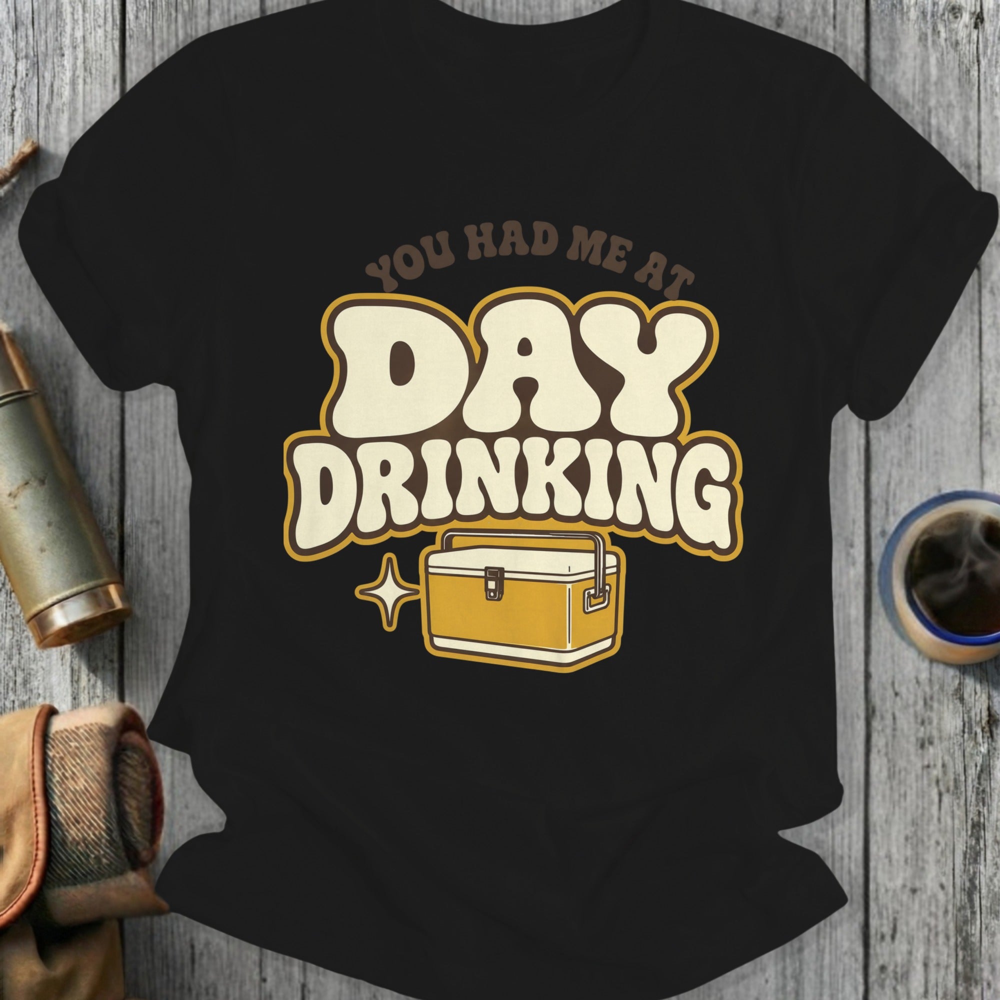 Black t-shirt with "You Had Me At Day Drinking" and cooler graphic.