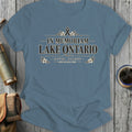 Blue t-shirt with "In Memoriam Lake Ontario" text and floral accents.