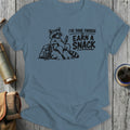 T-shirt with raccoon graphic and text "I'VE DONE ENOUGH TO EARN A SNACK".