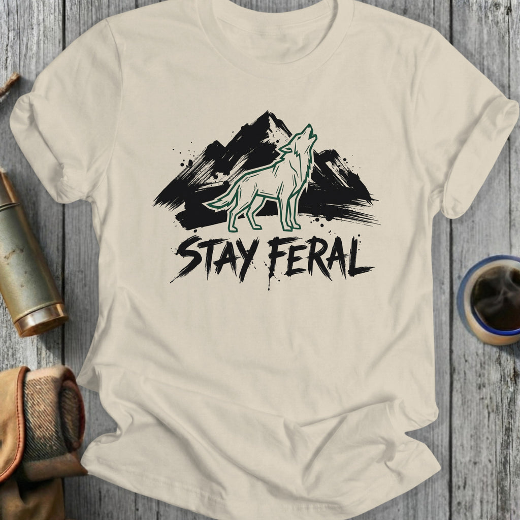 Cream t-shirt with distressed "STAY FERAl" text and a howling wolf silhouette.