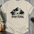 Cream t-shirt with distressed "STAY FERAl" text and a howling wolf silhouette.