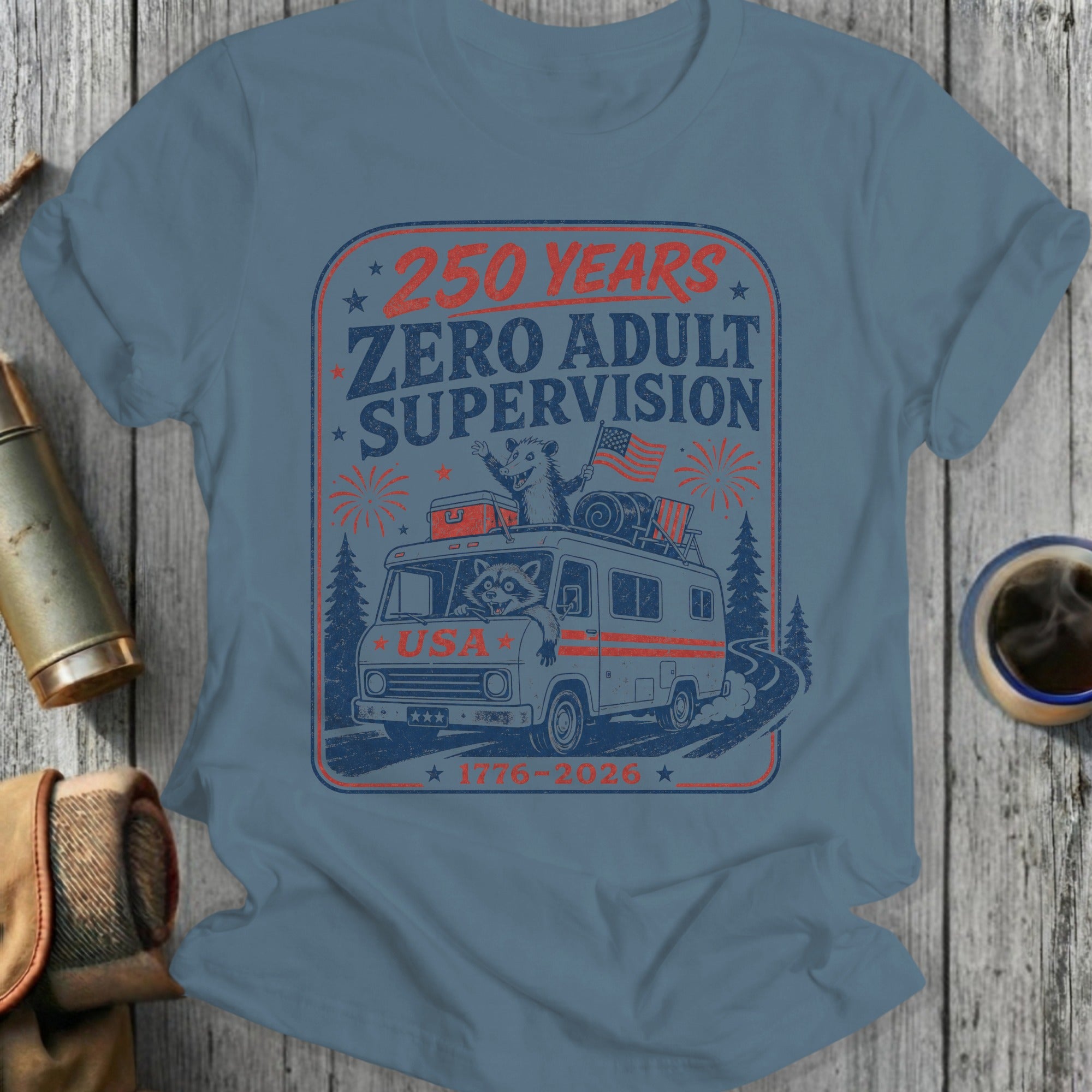 RV with raccoon wearing sunglasses and American flag, "250 Years Zero Adult Supervision" text.