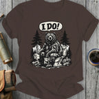 Bear sitting on a toilet with "I DO!" speech bubble, dark brown t-shirt.