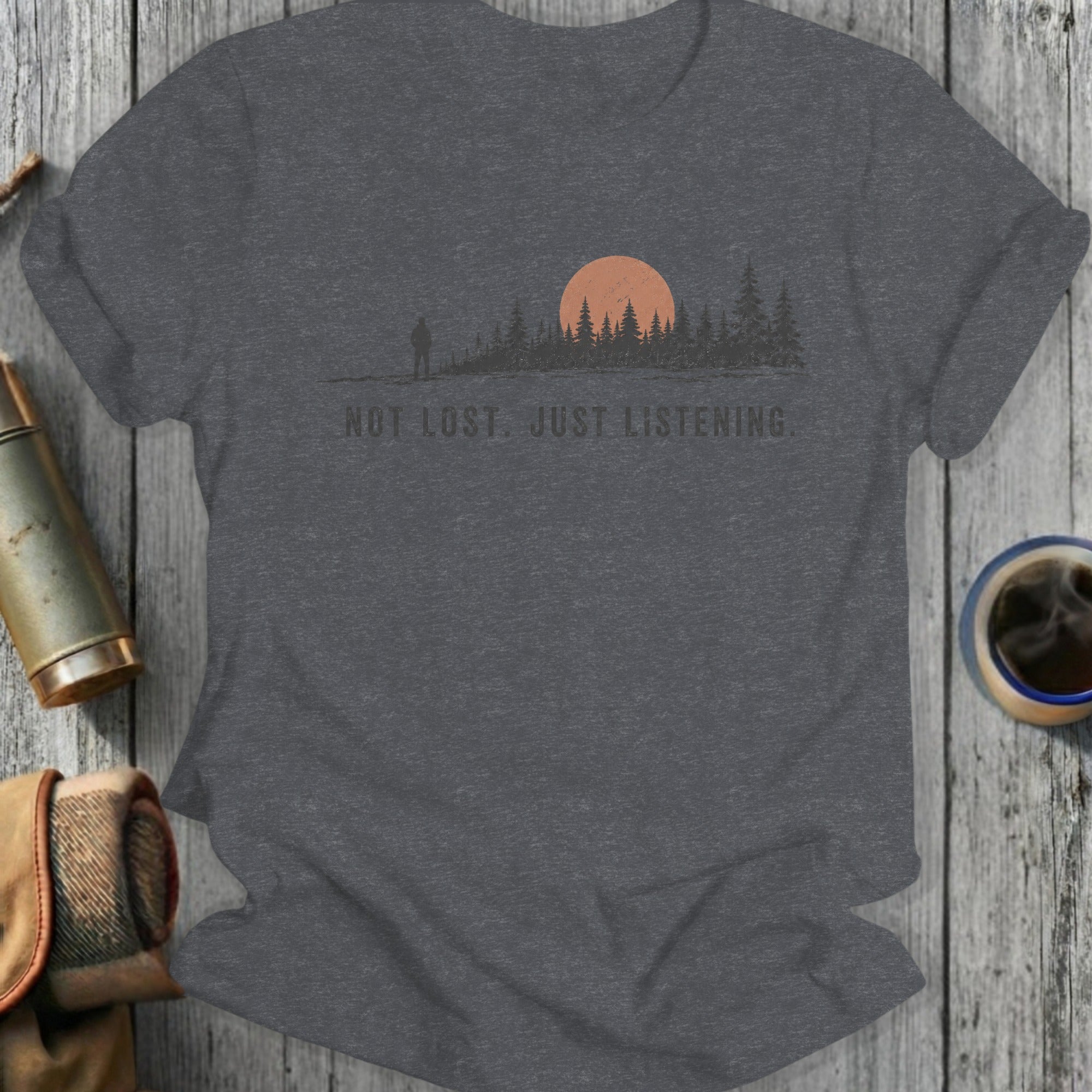 Dark grey t-shirt with sunset, pine trees, and "NOT LOST. JUST LISTENING." text.