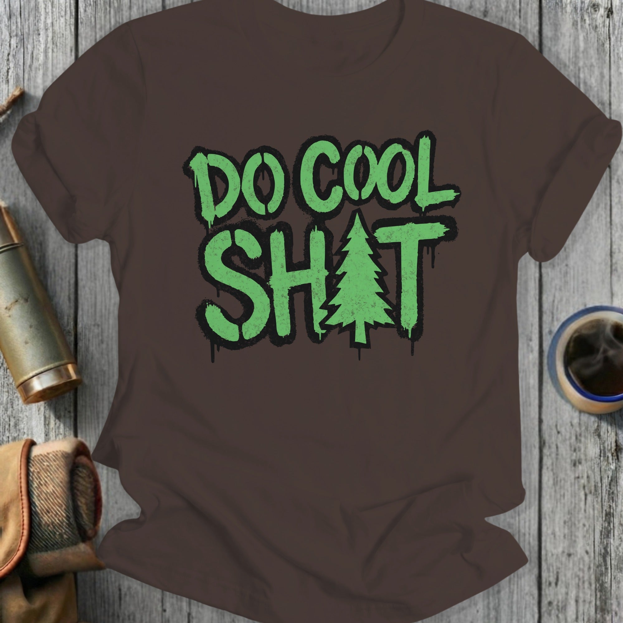 Brown t-shirt with "DO COOL SH*T" and a Christmas tree graphic.
