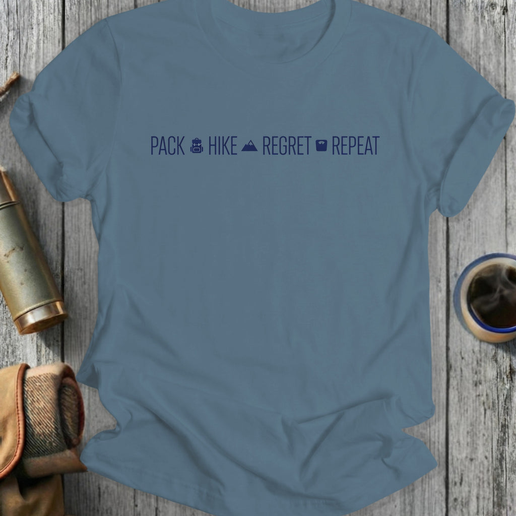Blue t-shirt with text "Pack Hike Regret Repeat" and icons.