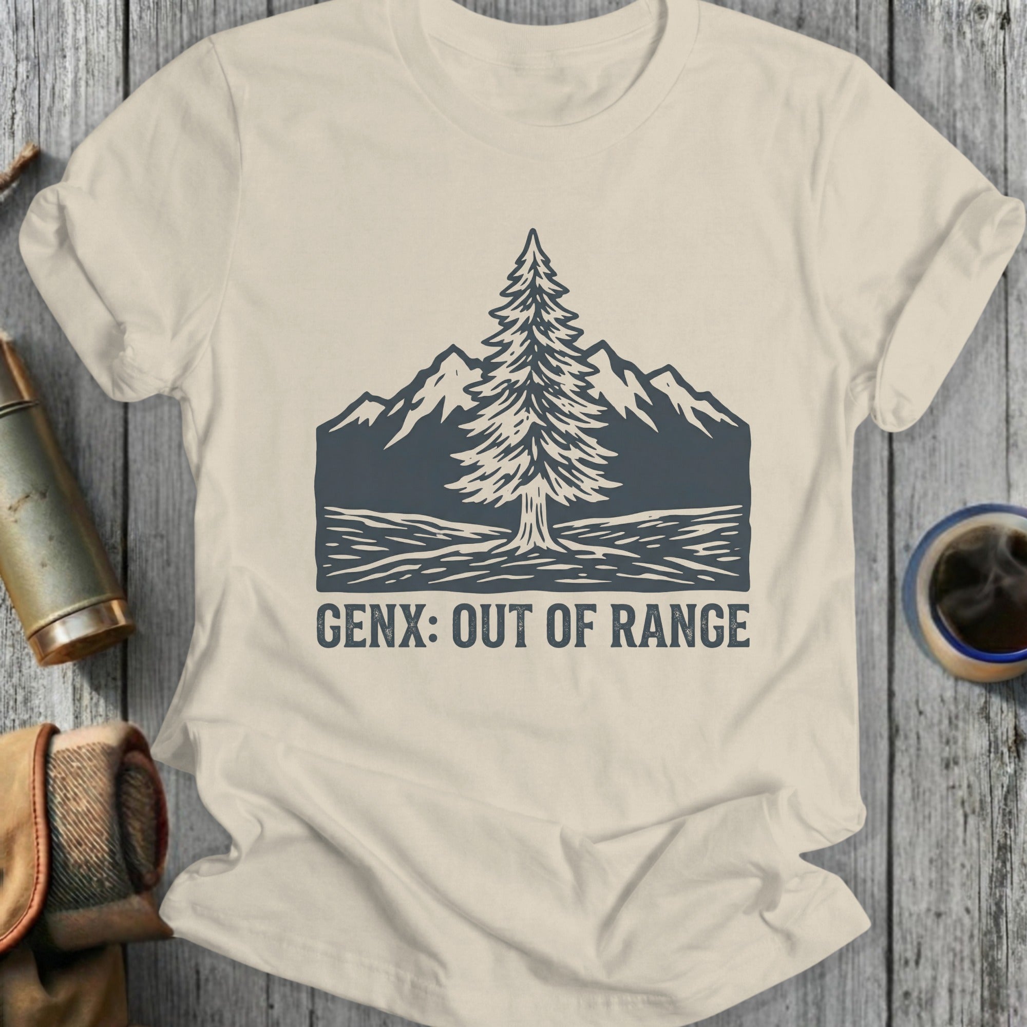 T-shirt with pine tree and mountains graphic, text "GENX: OUT OF RANGE".