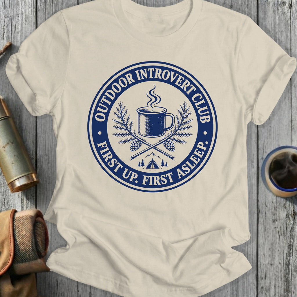 Cream t-shirt with blue circular graphic: "Outdoor Introvert Club First Up. First Asleep."