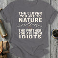 Gray t-shirt with text "The Closer You Are To Nature The Further You Are From Idiots".