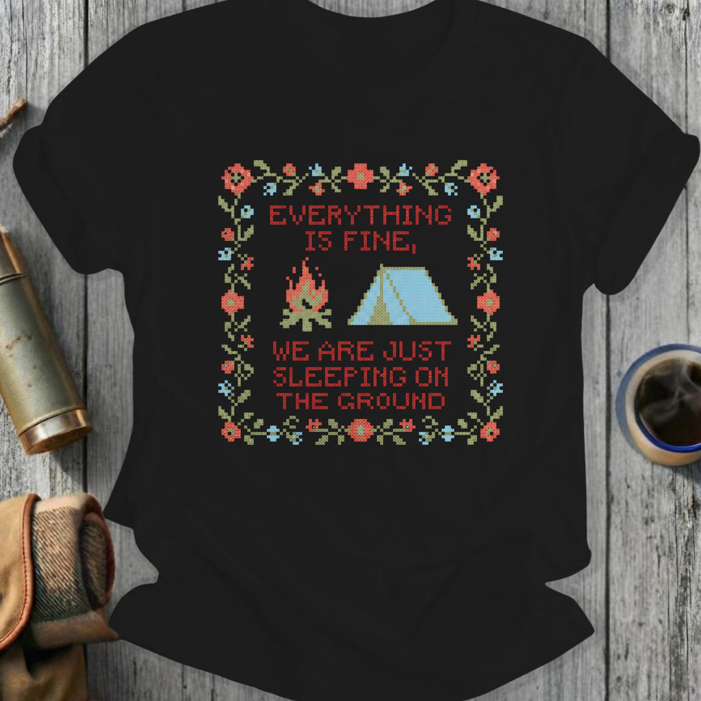 Black t-shirt with cross-stitch design of tent, campfire, and text.