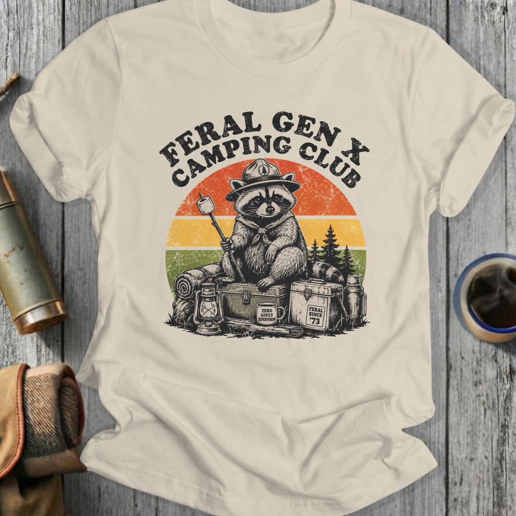 Feral Gen X Camping Club raccoon with marshmallow, vintage sunset, and camping gear.