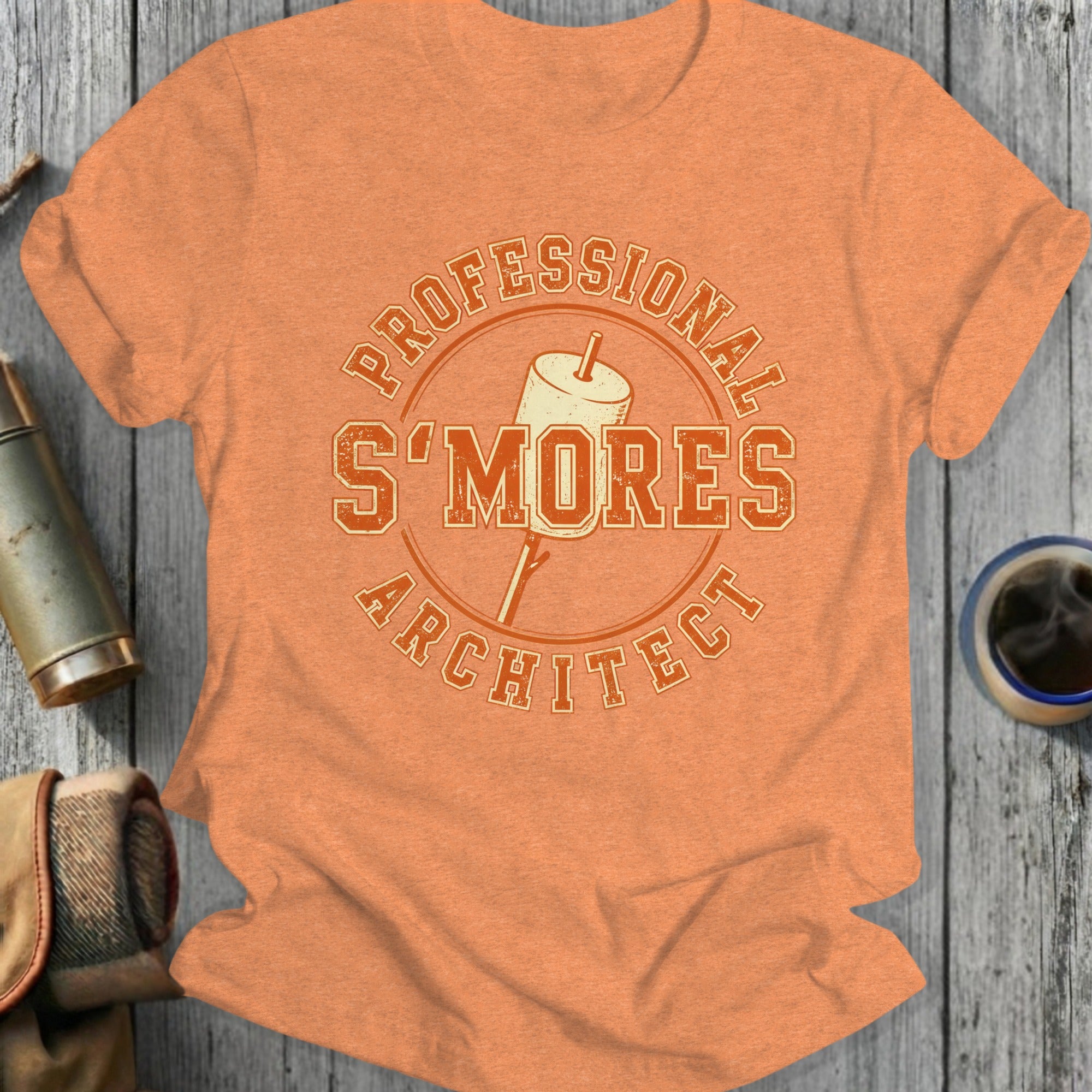 Orange t-shirt with "Professional S'Mores Architect" text design.