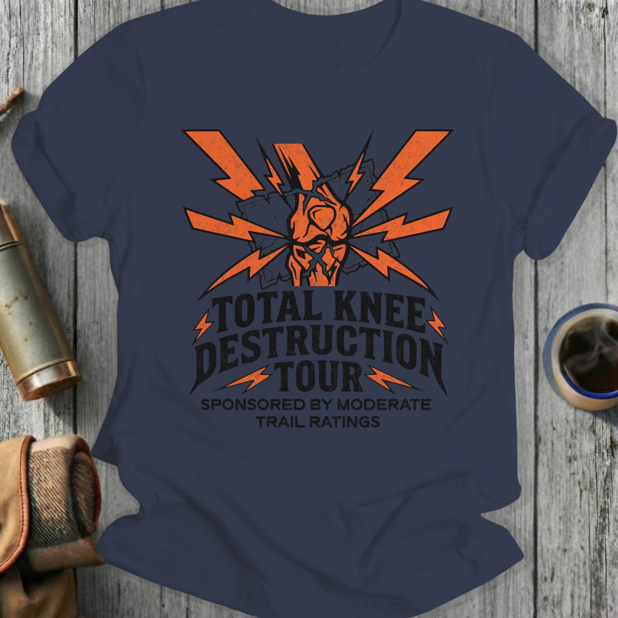Dark blue t-shirt with orange "Total Knee Destruction Tour" graphic.