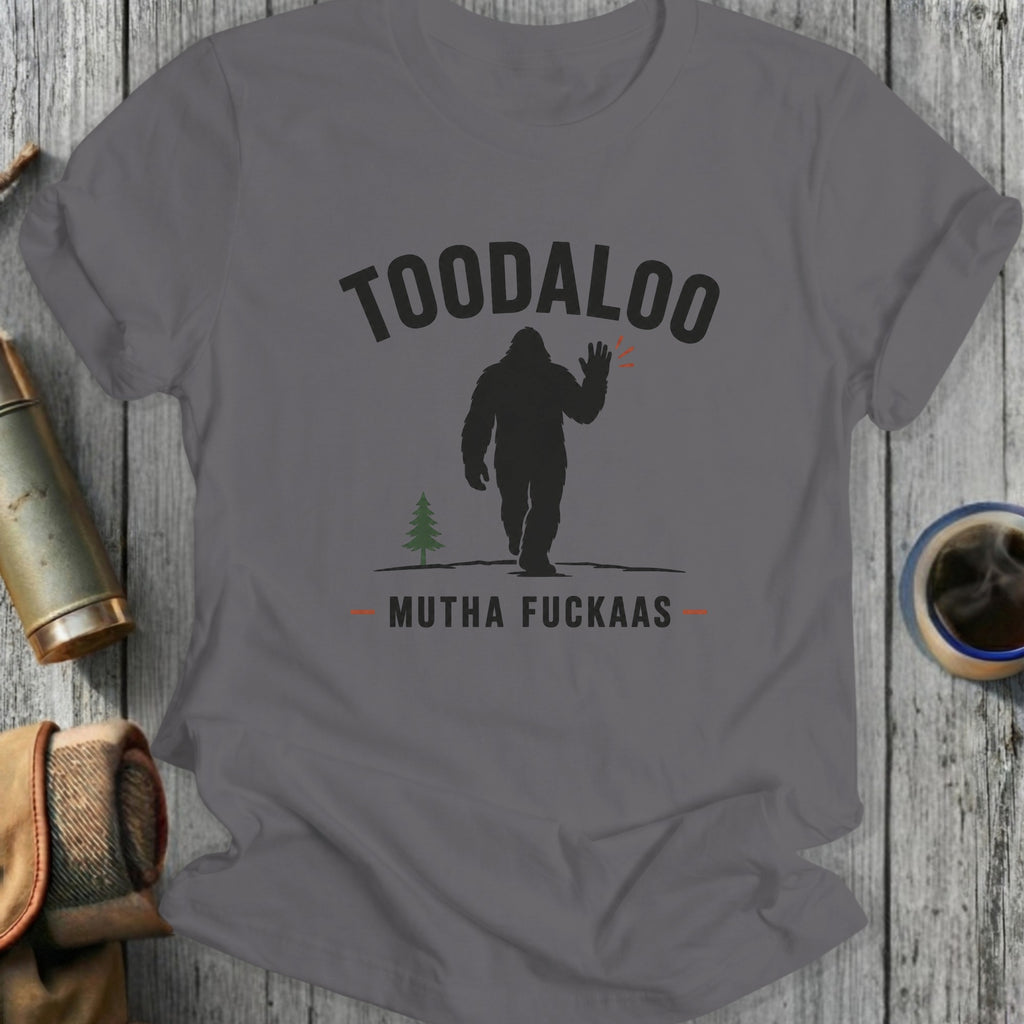 Grey t-shirt with Bigfoot waving and text "TOODALOO MUTHA FUCKAAS".