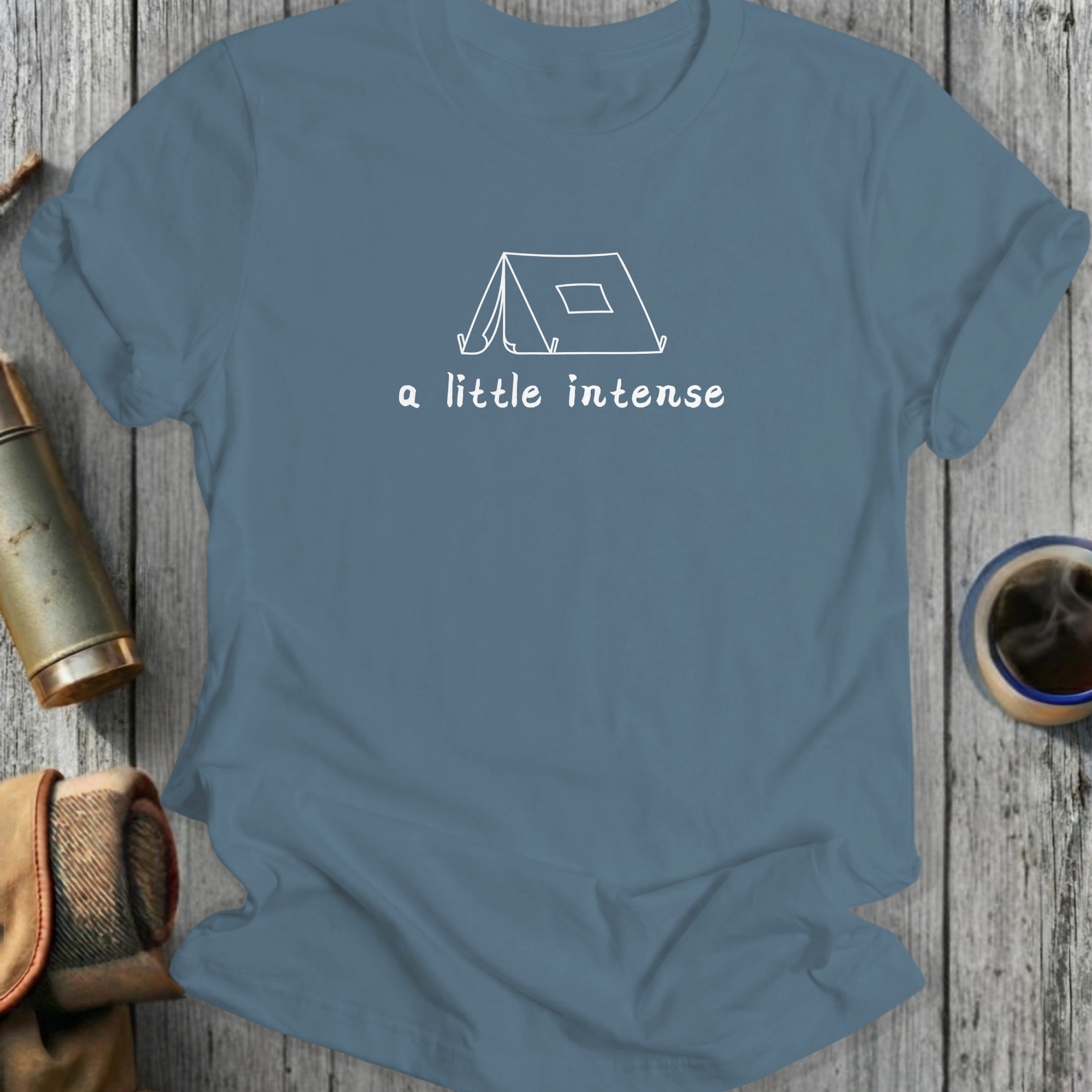 Blue t-shirt with a white line drawing of a tent and the text "a little intense".