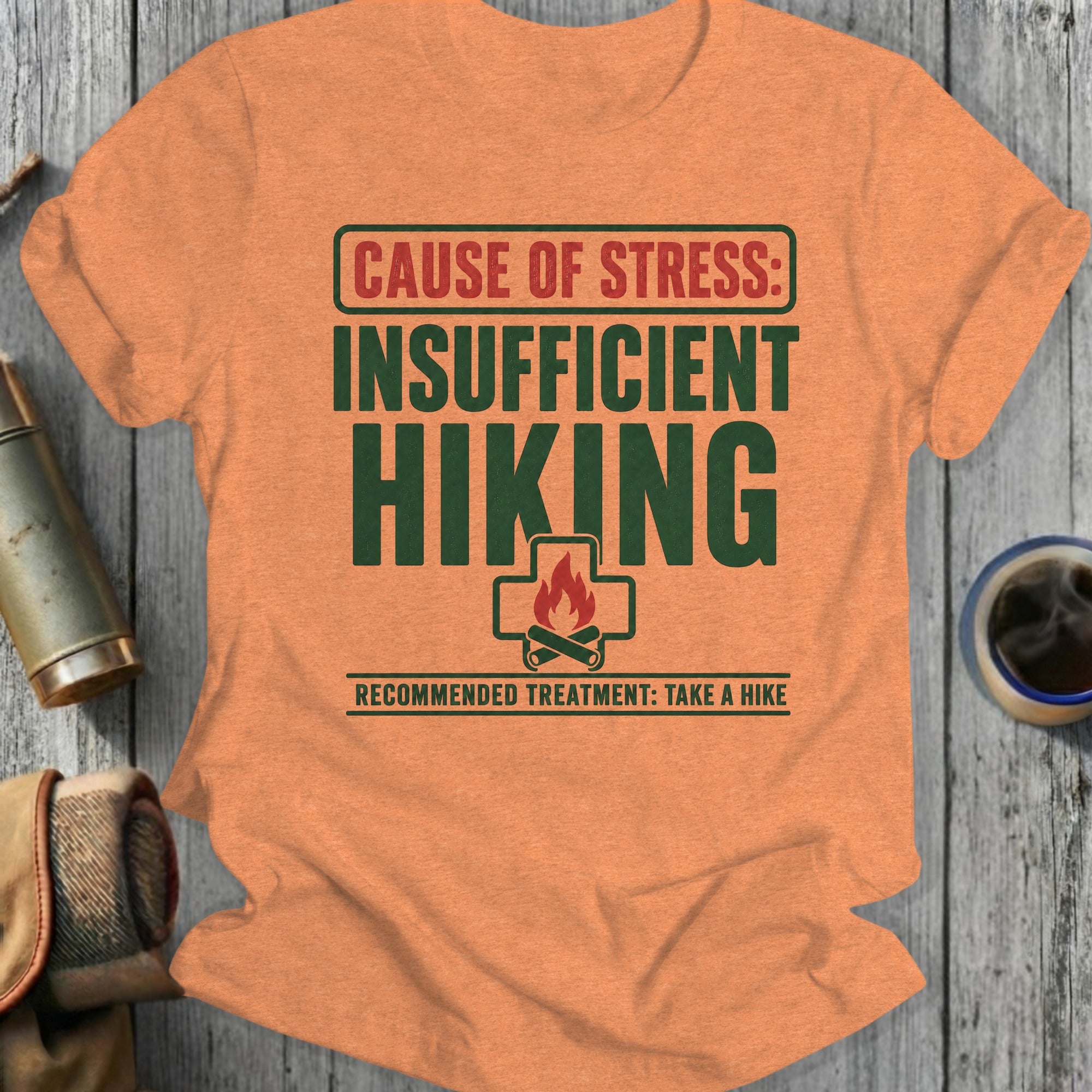 Orange t-shirt that reads "Cause of stress: Insufficient hiking. Recommended treatment: Take a hike."