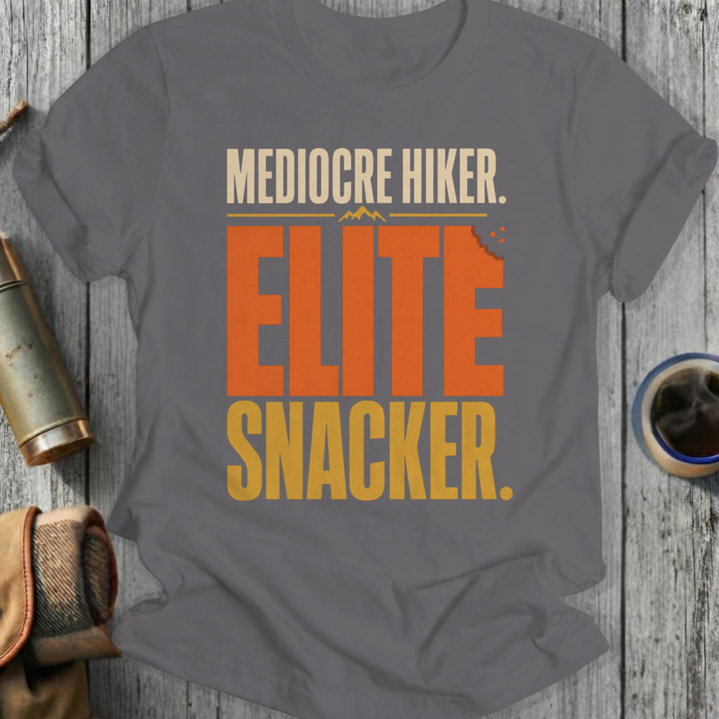 Grey t-shirt with text: Mediocre Hiker. Elite Snacker.