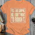 Orange t-shirt with text: "YES, I LIKE CAMPING. NO, I DON'T WANT TO ROUGH IT."