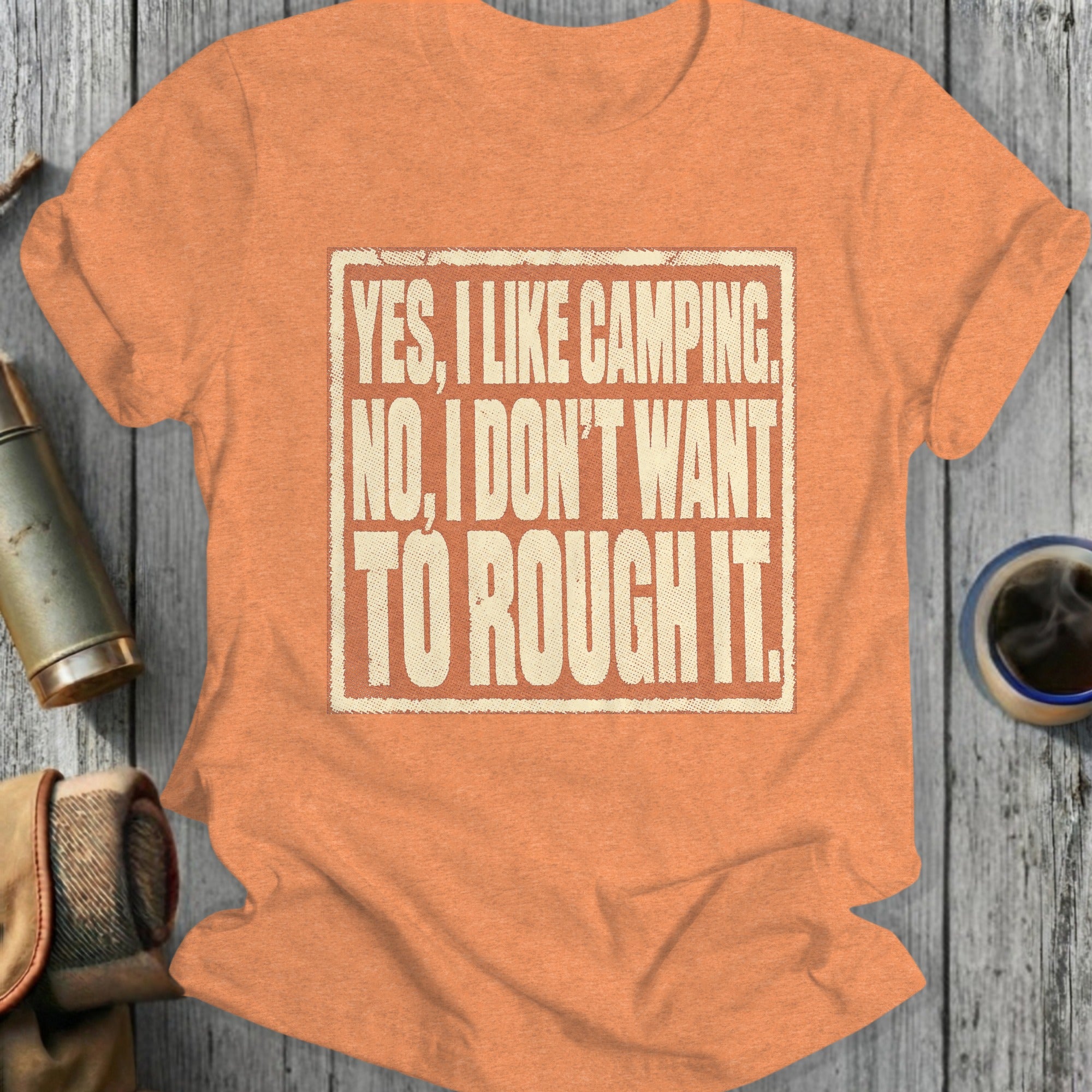 Orange t-shirt with text: "YES, I LIKE CAMPING. NO, I DON'T WANT TO ROUGH IT."