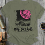 Olive green t-shirt with a distressed graphic of a turtle on a rock under a pink moon.