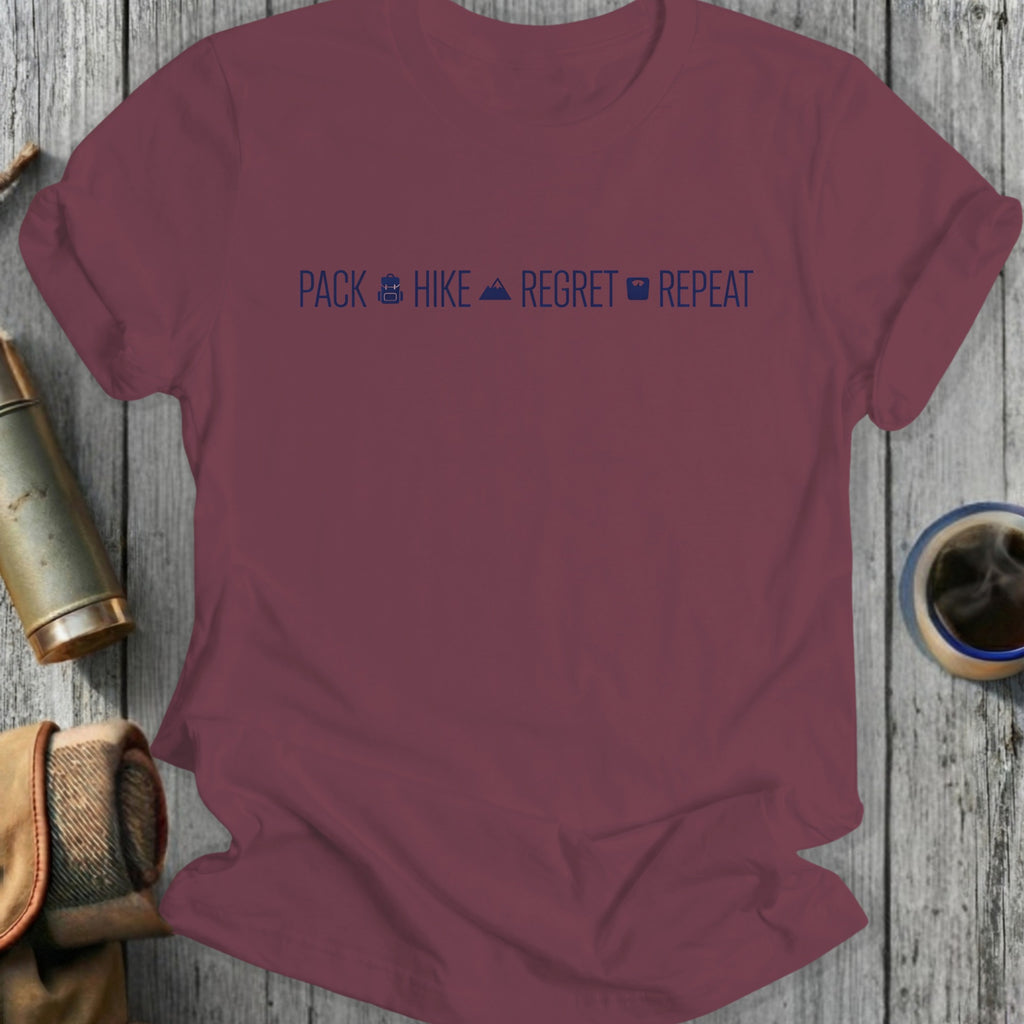 Burgundy t-shirt with "Pack Hike Regret Repeat" text and icons.
