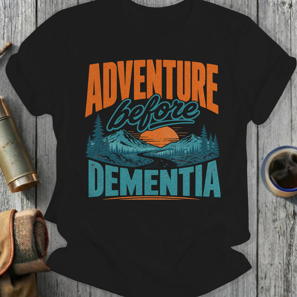 Black t-shirt with "Adventure Before Dementia" text and mountain landscape graphic.