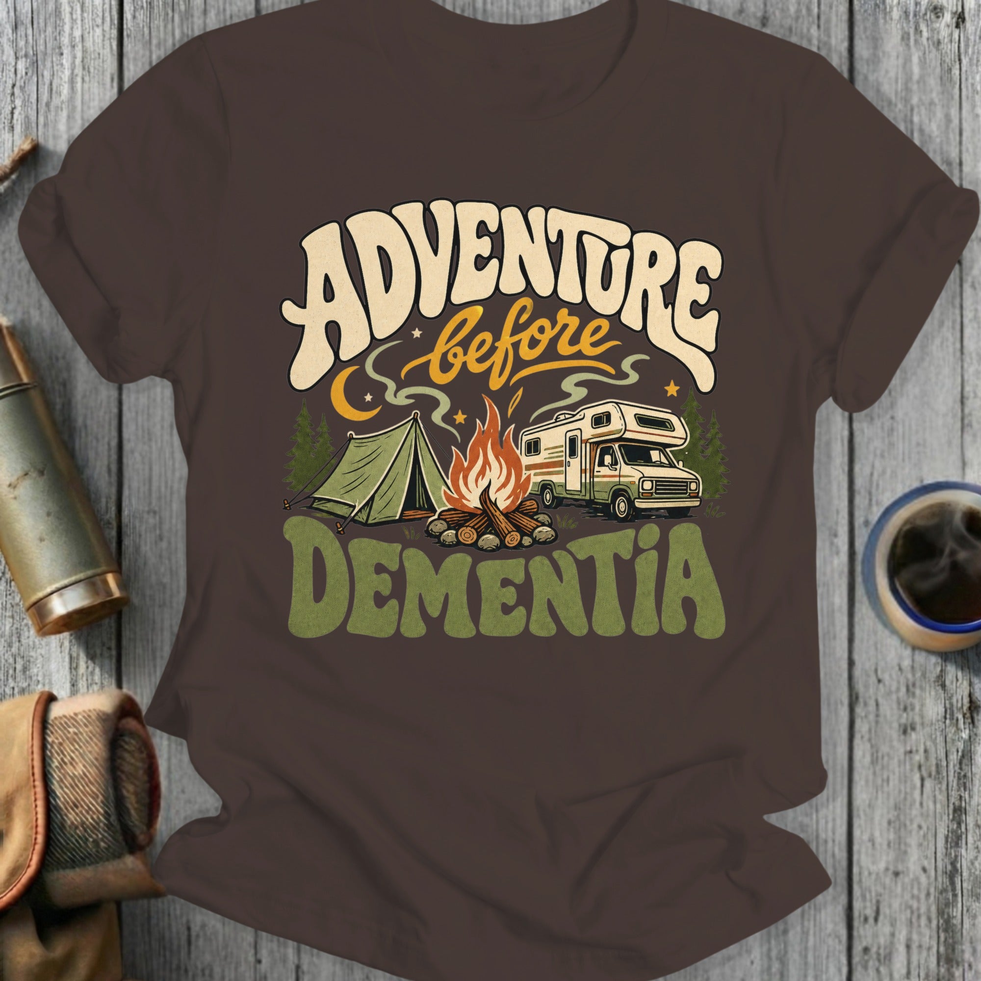 Brown t-shirt with "Adventure Before Dementia" text, a tent, campfire, and RV.