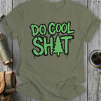Green t-shirt with "DO COOL SHIT" text and a Christmas tree graphic.