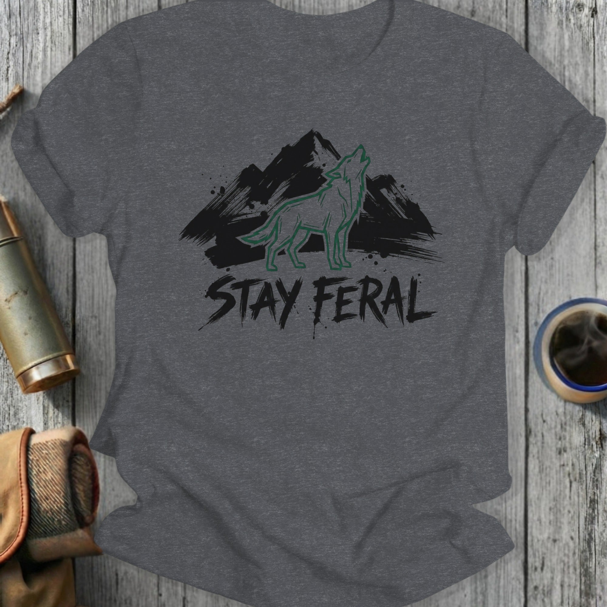 Dark grey t-shirt with green wolf and mountain graphic and "STAY FER AL" text.