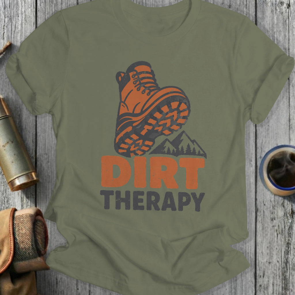 Orange hiking boot graphic with "DIRT THERAPY" text on a green t-shirt.
