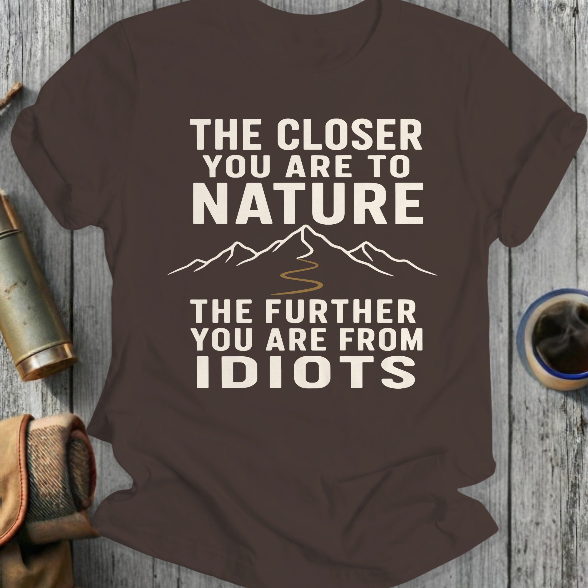 Brown t-shirt with text "The closer you are to nature the further you are from idiots."