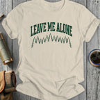 T-shirt with "Leave Me Alone" text above a forest silhouette.