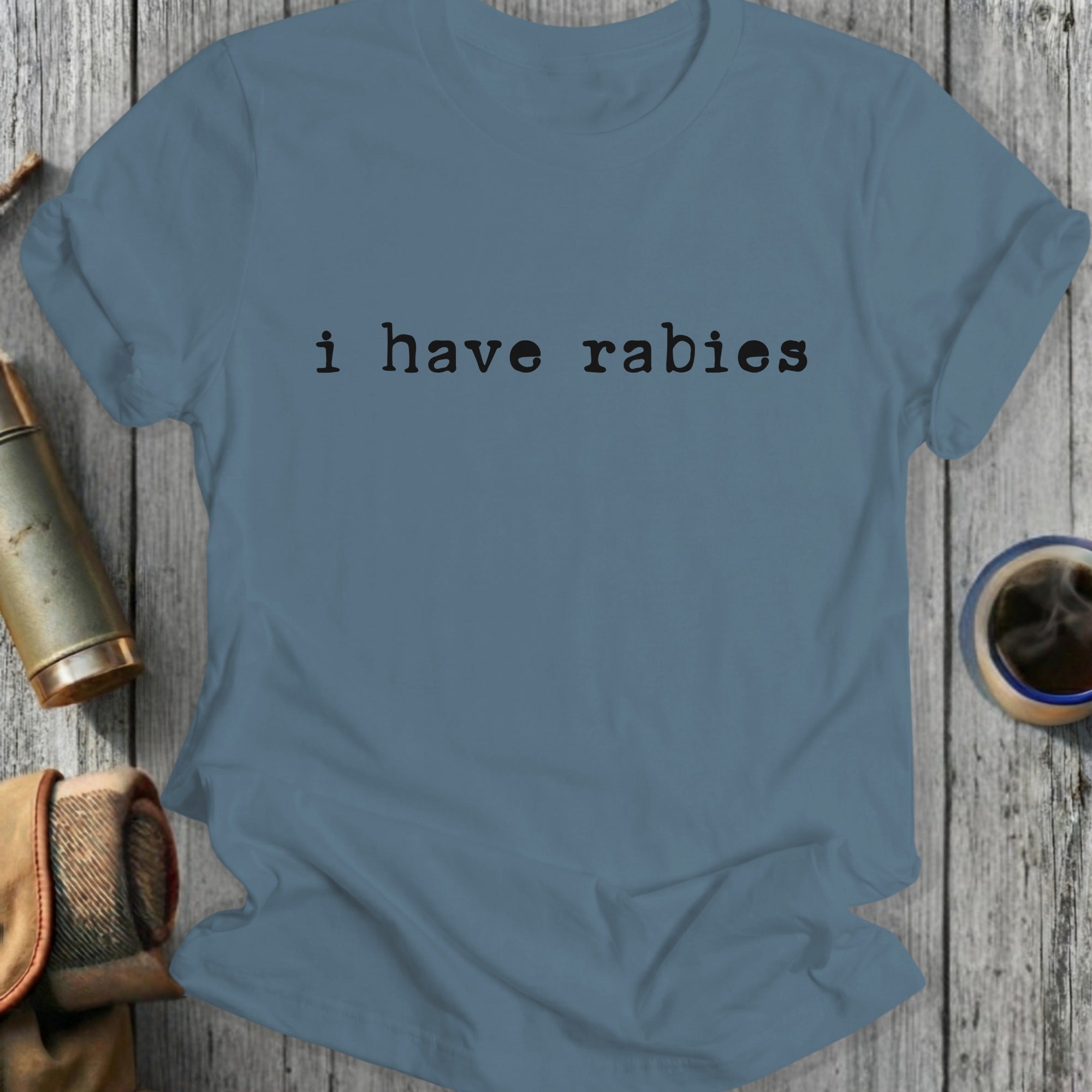 Blue t-shirt with "i have rabies" printed in black text.
