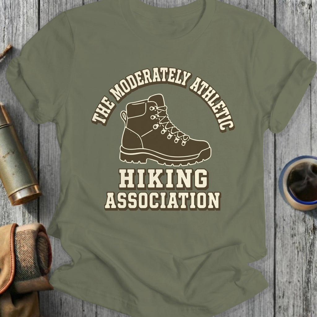 Green t-shirt with "The Moderately Athletic Hiking Association" and hiking boot graphic.