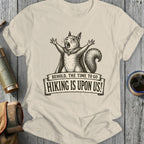 Squirrel with arms raised wearing a cape, text reads "Hiking is upon us!".